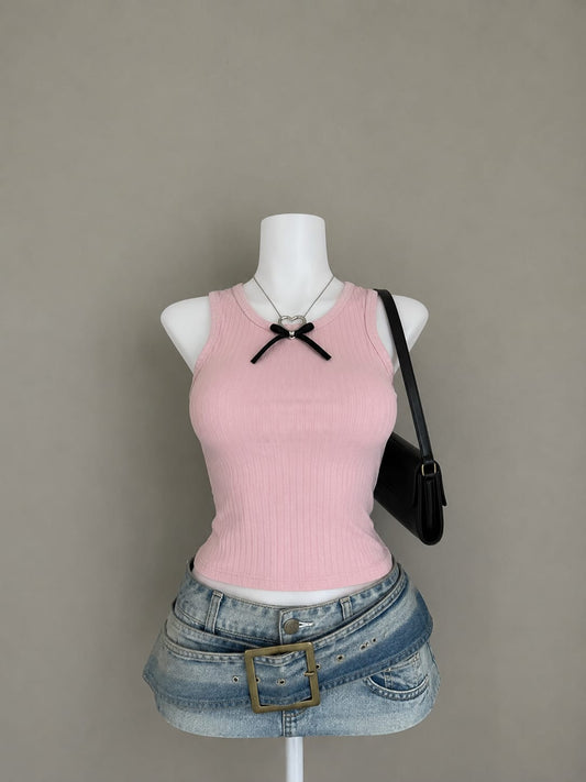 Baby pink ribbed sleeveless crop tank top styled on mannequin