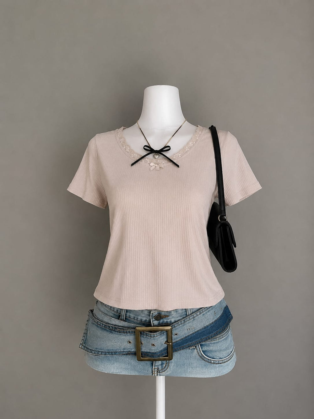 Blush pink ribbed crop top with floral lace neckline trim styled on mannequin