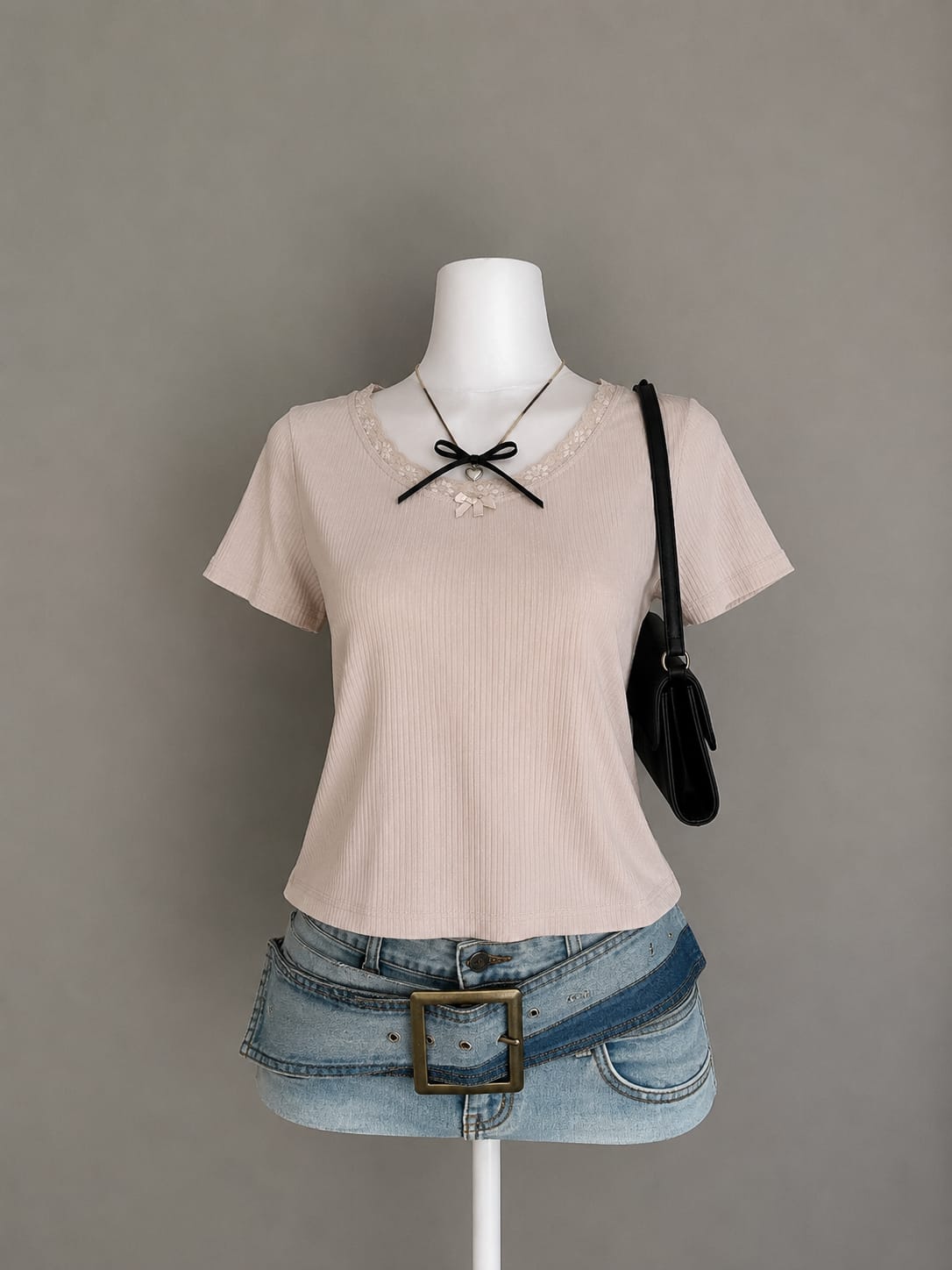 Blush pink ribbed crop top with floral lace neckline trim styled on mannequin