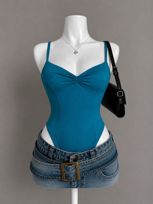 Teal sweetheart ruched bodysuit with spaghetti straps and corset seaming on mannequin