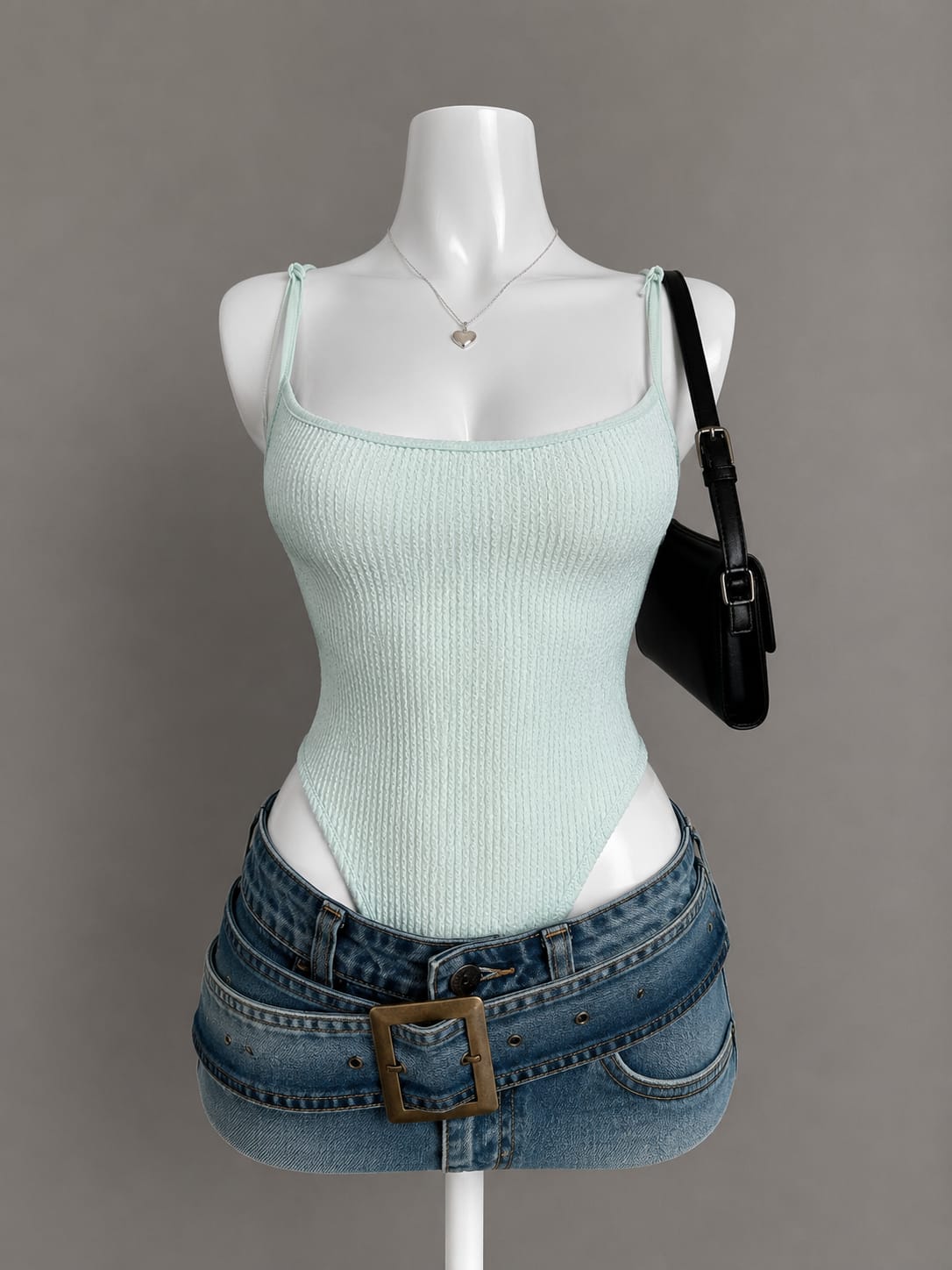 Mint green textured bubble knit scoop neck bodysuit with knotted spaghetti straps on mannequin