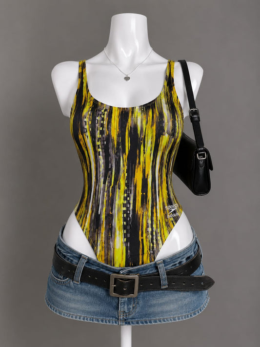 Yellow and black abstract brushstroke print bodysuit with scoop neck on mannequin