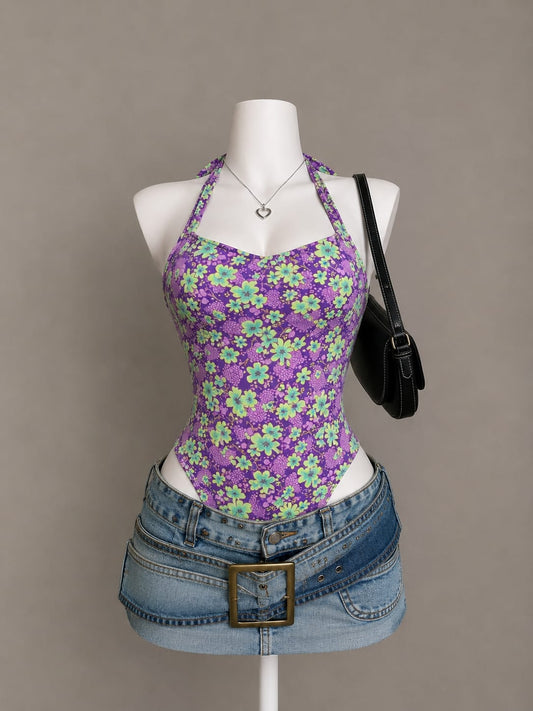 Purple floral print halter neck bodysuit with sweetheart neckline styled with denim mini skirt on mannequin