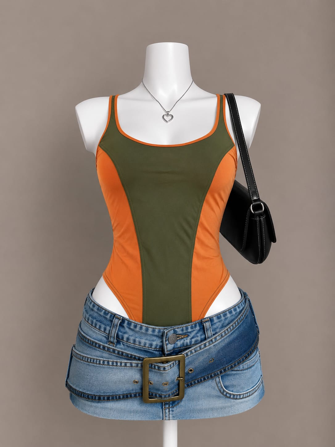 Olive green and orange color-block spaghetti strap bodysuit on mannequin