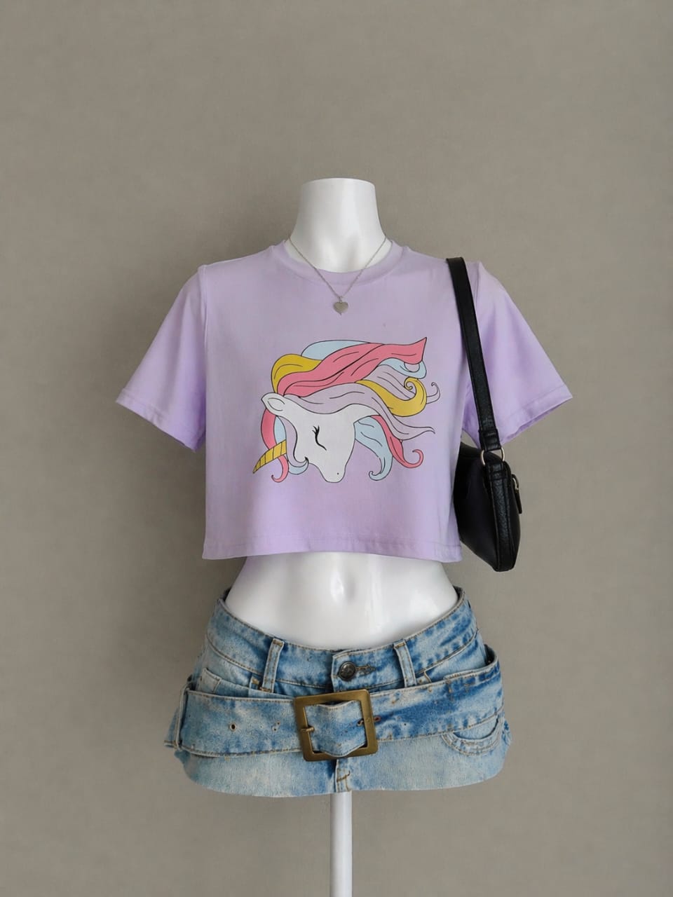 Lavender unicorn graphic crop tee on mannequin