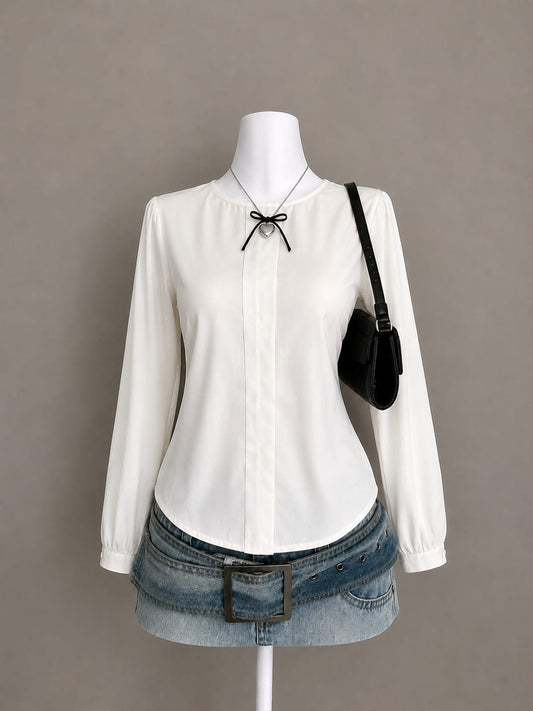 White long sleeve blouse on mannequin